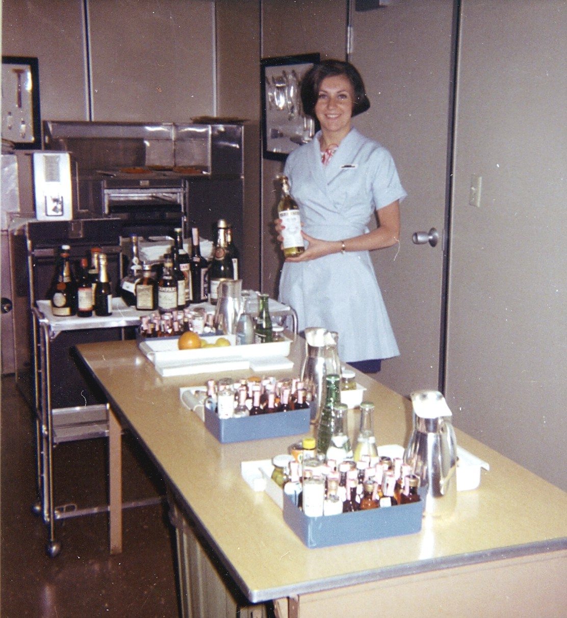 1968 April, Maureen van Leeuwen practices cocktail preparation at the Pan Am Flight Service Academy.