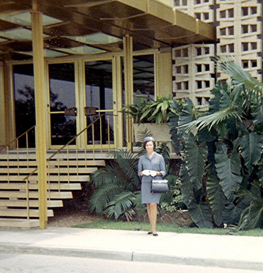 1968 May, Maureen van Leeuwen posing in front of the Pan Am Flight Service Academy Miami, Florida.